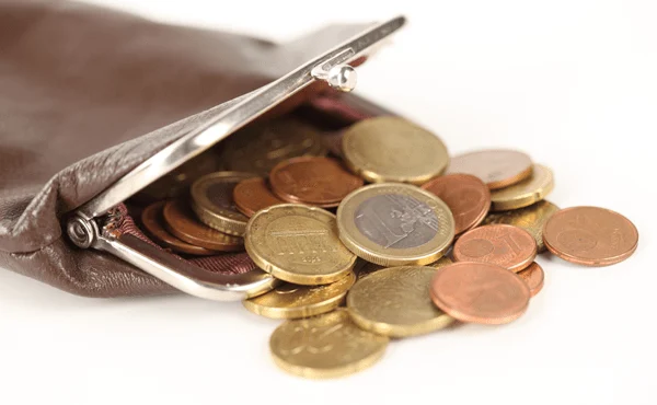money spilling out of a purse