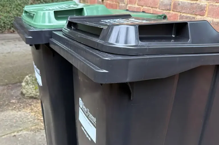 New black and green wheelie bins